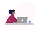Woman working on laptop at desk